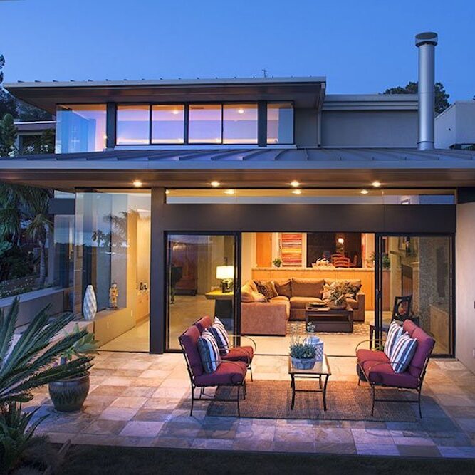 A modern house with a garage and a balcony.