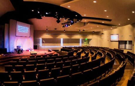 A large auditorium with many rows of seats.