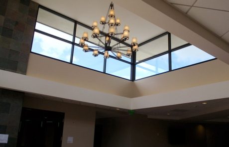 A large chandelier in the middle of an open room.