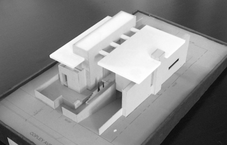 A model of the building is shown in black and white.